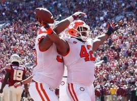 Defensive lineman Christian Wilkins (42) scores a rushing touchdown for Clemson against Florida State. (Image: Mark Wallheiser/AP)