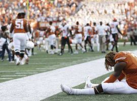 A dejected Texas wide receiver Armanti Foreman sits on the sidelines after the Longhorn’s 30-27 upset loss to Oklahoma State. (Image: Jay Janner/American-Stateman)