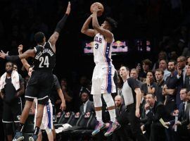 Jimmy Butler from the Philadelphia Sixers takes a three-point shot over the Brooklyn Nets’ Rondae Hollis-Jefferson (24) before connecting on his second game-winning shot in eight days. (Image: Getty)