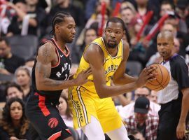 Kawhi Leonard from the Toronto Raptors and Kevin Durant from the Golden State Warriors face off in an overtime battle in Toronto. (Image: Tom Szczerbowski/USA Today)