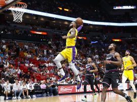 LeBron James throws down a dunk during his 51-point performance in a victory against his former team, the Miami Heat. (Image: AP)