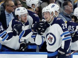 Winnipeg Jets' Patrik Laine (29), of Finland, is congratulated by Brendan Lemieux after scoring during the second period against the St. Louis Blues. (AP Photo/Jeff Roberson)