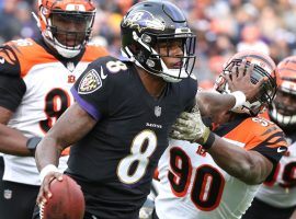 Rookie QB Lamar Jackson from the Baltimore Bengals stiff arms Michael Johnson (90) from the Cincinnati Bengals. (Image: Mitch Stringer/USA Today)