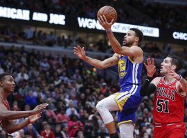 Golden State Warriors guard Stephen Curry drives past Chicago Bulls defenders during their regular season NBA game on Oct. 29, 2018. (Image: Kamil Krzaczynski/AP)