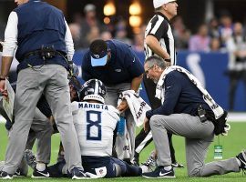 Quarterback Marcus Mariota (8) examined by medical staff after being sacked by the Indianapolis Colts. (Image: Thomas J. Russo/USA Today)