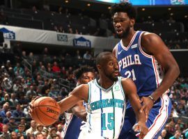Charlotte's Kemba Walker drives by Philadelphia's Joel Embiid during his 60-point night. (Image: Getty)