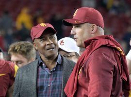 USC athletic director, Lynn Swann, left, decided not to fire football head coach Clay Helton. (Image: USA Today Sports)
