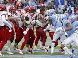 After North Carolina State scored the winning touchdown in overtime to beat North Carolina, a brawl broke out. (Image: AP)