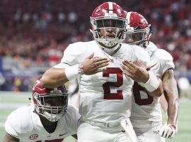 Quarterback Jalen Hurts celebrates after scoring against Georgia in the SEC Championship Game on Saturday. (Image: AJ Reynolds/Athens Banner-Herald/AP)