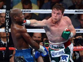 Canelo Alvarez (right) says he would be up for a rematch with Floyd Mayweather (left), though there haven’t been any talks between the two fighters. (Image: Ethan Miller/Getty)