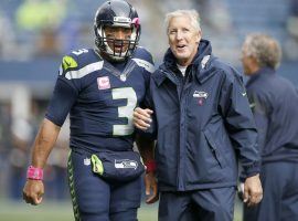 Seahawks QB Russell Wilson and head coach Pete Carroll during warmups in Seattle. (Image: Otto Greule Jr/Getty)