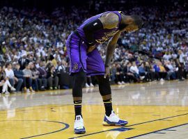 LeBron James from the LA Lakers grimaces after injuring his groin in the third quarter against the Golden State Warriors. (Image: Thearon W. Henderson/Getty)