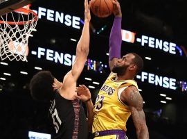 Jarrett Allen of the Brooklyn Nets blocks an attempted dunk by LeBron James of the Los Angeles Lakers. (Image: AFP)