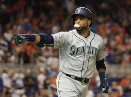 Robinson Cano points to the Seattle Mariners dugout after hitting a home run last season. (Image: Mike Ehrmann/Getty)