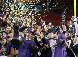 Washington head coach Chris Petersen (center left) and cornerback Byron Murphy (center right) celebrate after UW's 10-3 victory over Utah in the Pac-12 Championship Game in Santa Clara. (Image: Tony Avelar/AP)