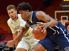 Vernon Carey Jr, from University Prep, drives by a Gulliver Prep player during the Hoophall Miami Showcase in Miami last year. (Image: Jasen Vinlove/USA Today)