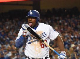 Dodgers outfielder Yasiel Puig shows his bat some love during a game at Dodger Stadium in Los Angeles. (Image: Richard Mackson/USA Today Sports)