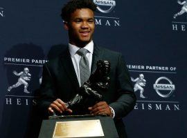 Oklahoma quarterback Kyler Murray poses with his Heisman Trophy he won on Saturday. (Image: Getty)