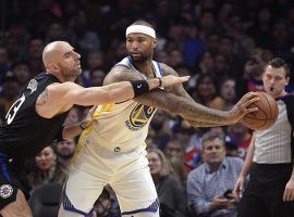 The LA Clippers Marcin Gortat defends DeMarcus Cousins during his debut for the Golden State Warriors at Staples Center in Los Angeles. (Image: Mark J. Terrill/AP)