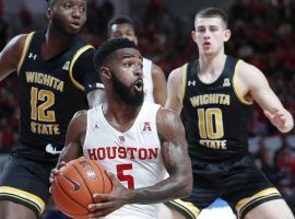 Houston Cougars guard Corey Davis (5) drives by Wichita State's Morris Udeze (12) in a game at Fertitta Center in Houston. (Image: Karen Warren/Houston Chronicle)