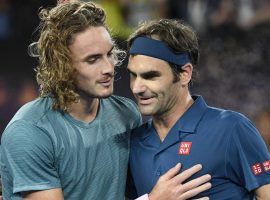 Roger Federer (right) was defeated by Stefanos Tsitsipas (left) in the fourth round of the 2019 Australian Open. (Image: AP)