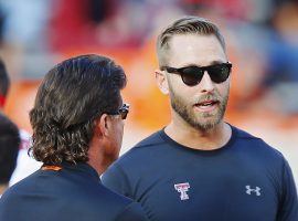Kliff Kingsbury (right) during pre-game warmups during a Texas Tech home game in Lubbock. (Image: Brian Bahr/Getty)