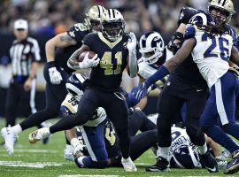 New Orleans Saints running back Alvin Kamara eludes tacklers against the LA Rams. (Image: Wesley Hitt/Getty)