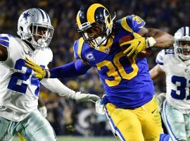LA Rams running back Todd Gurley stiff arms Dallas Cowboys cornerback Chidobe Awuzie in the NFC Divisional Game at the LA Coliseum in Los Angeles. (Image: Robert Hanashiro/USA Today Sports)