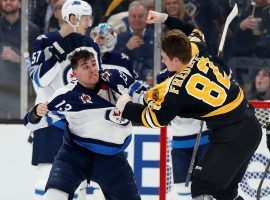 The Winnipeg Jets Brandon Tanev and Trent Frederic from the Boston Bruins exchange punches during a game a TD Garden in Boston. (Image: Winslow Townsend/USA Today Sports)