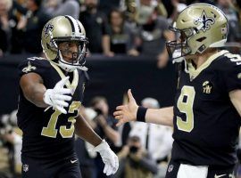 New Orleans Saints QB Drew Brees congratulates WR Michael Thomas after a touchdown drive in the Superdome. (Image: Chris Graythen/Getty)