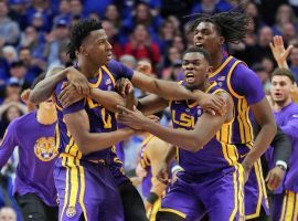 LSU's Kavell Bigby-Williams is mobbed by his teammates after a game-winning shot against Kentucky in Lexington, KY. (Image: Mark Zerof/USA Today Sports)
