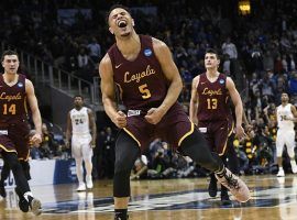 Loyola-Chicago guard Marques Townes (5) celebrates after hitting a shot against Nevada during the 2018 March Madness regional semifinal. (Image: John Amis/AP)