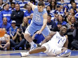 Luke Maye (32) from North Carolina chases the ball after Duke's Zion Williamson (1) slips when his sneaker fell apart at the seams during a UNC/Duke game at Cameron Stadium in Durham, NC. (Image: Streeter Lecka/Getty)