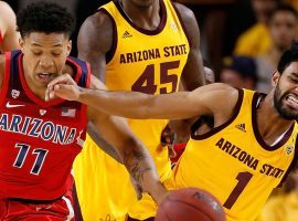 Arizona forward Ira Lee (11) and Arizona State guard Remy Martin (1) battle for the ball in a game at Wells Fargo Arena in Tempe, Arizona earlier this season. (Image: Chris Coduto/Getty)
