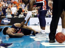 Auburn Tigers' forward Chuma Okeke (ground) screams in pain after suffering a knee injury against the North Carolina during 2019 March Madness Sweet 16 game in Kansas City, Missouri. (Image: Jamie Squire/Getty)