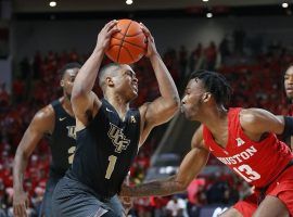 BJ Taylor (1), UCF point guard, is hand-checked by Dejon Jarreau (13) from the Houston Cougars at Hofheinz Arena in Houston, T (Image: Bob Levey/Getty)