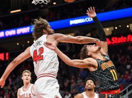 Atlanta Hawks rookie Trae Young gets hacked by Chicago Bulls center Robin Lopez during a 4 OT thriller at State Farm Arena in Chicago. (Image: Dale Zanine/USA Today Sports)