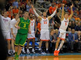 Virginia guard Kyle Guy (5) drills a three pointer against the Oregon Ducks in a Sweet 16 game in Louisville, Kentucky. (Image: John McDonnell/Washington Post)