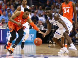 Duke's Zion Williamson (1) and Syracuse's Oshae Brissett (11) lunge for the ball in ACC tournament game at the Spectrum Center in Charlotte, NC. (Image: Jeremy Brevard/USA Today Sports)