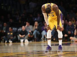 Los Angeles Laker LeBron James stands dejected Monday as the team was unable to beat the Clippers and saw their playoff chances dwindle. (Image: Getty)