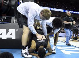 UCF players console Aubrey Dawkins after the Knights came up a point short in their attempt to upset No. 1 Duke. (Image: USA Today Sports)