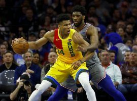 Giannis Antetokounmpo (left) and the Milwaukee Bucks clinched the NBAâ€™s best record with a win over the Philadelphia 76ers on Thursday. (Image: Matt Slocum/AP)