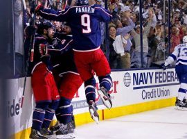 Forward Artemi Panarin (9) celebrates with his Columbus Blue Jackets teammates after they complete a four-game sweep of the Tampa Bay Lightning in the opening round of the Stanley Cup playoffs in Columbus, OH. (Image: Kirk Irwin/Getty)