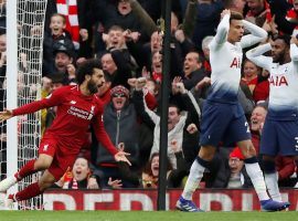 Liverpoolâ€™s Mohamed Salah (left) celebrates after a late own goal gave his team a 2-1 win over Tottenham on Sunday. (Image: Paul Childs/Action Images/Reuters)