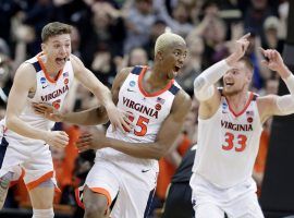 Kyle Guy (5), Mamadi Diakite (25), Jack Salt (33) from Virginia celebrate their Final Four bid after defeating Purdue in the Elite 8 in Louisville, Kentucky. (Image: Thomas J. Russo/USA Today Sports)