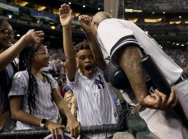 CC Sabathia is congratulated by his family after recording his 3,000 strikeout in a game against the Diamondbacks at Chase Field in Phoenix, Arizona. (Image: Matt York/AP)