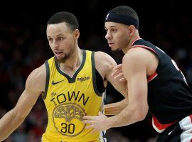 Steph Curry of the Golden State Warriors playing against his younger brother, Seth Curry, from the Portland Trailblazers at the Moda Center in Portland, OR. (Image: Abbie Parr/Getty)