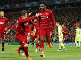 Divock Origi celebrates with teammates after scoring the fourth Liverpool goal in their 4-0 win over Barcelona in the second leg of their Champions League semifinal. (Image: Tom Jenkins/The Guardian)