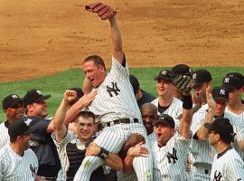 The Yankees carry pitcher David Cone (center) off the field after pitching a perfect game on July 19, 1999 at Yankee Stadium in the Bronx. (Image: AP)
