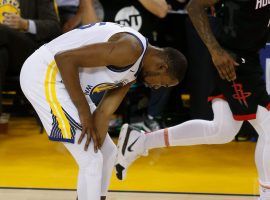 Kevin Durant of the Golden State Warriors clutches his injured calf before leaving Game 5 against the Houston Rockets. (Image: Getty)